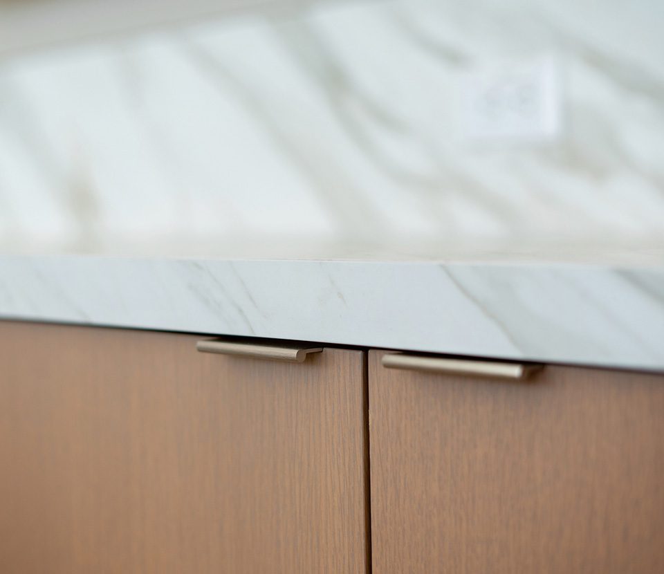 Marble countertop above custom wood cabinets