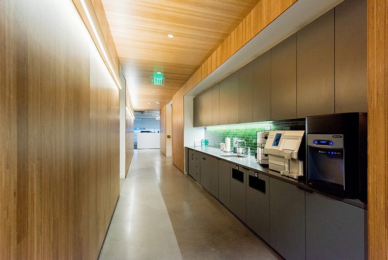 Office hallway with built-in coffee nook and kitchenette