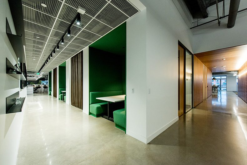 Hallway with built-in booth seating and custom shelving