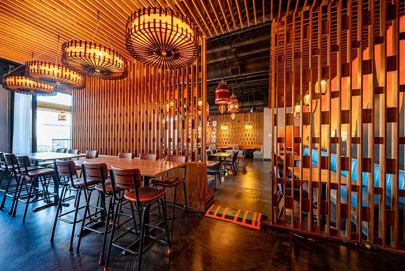 Decorative wood ceiling and wall panels in restaurant seating area