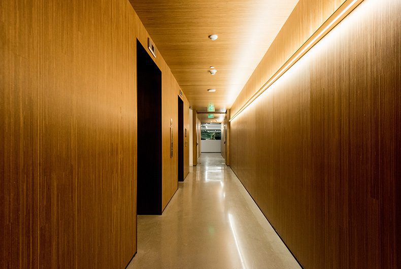 Office hallway with wood wall and ceiling paneling