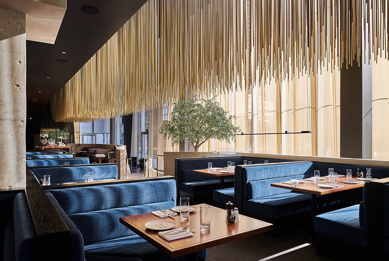 Restaurant upholstered booths and chandelier-effect ceiling system