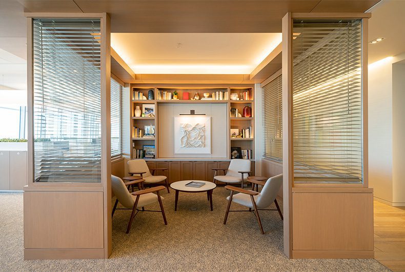 Library and sitting lounge with wood built-in shelving.