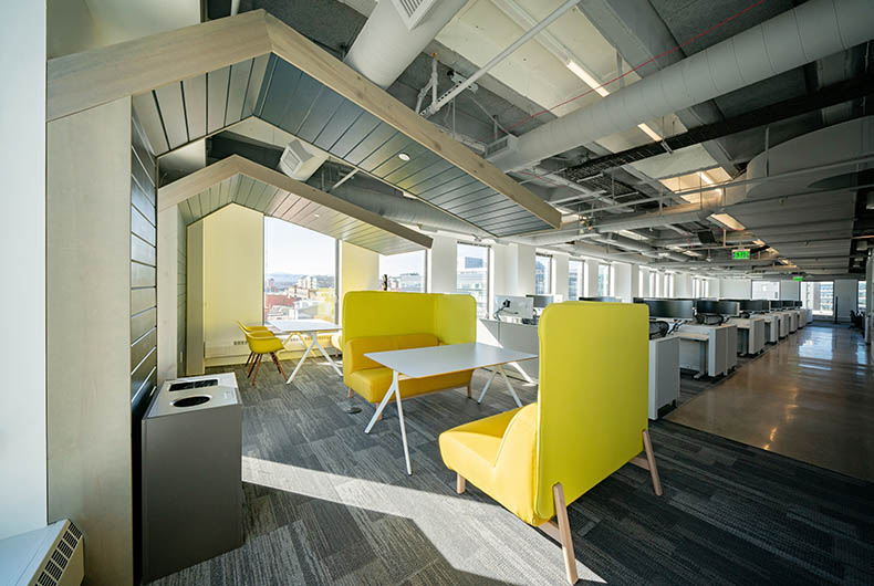 Office seating area with conference desks and personal desk space