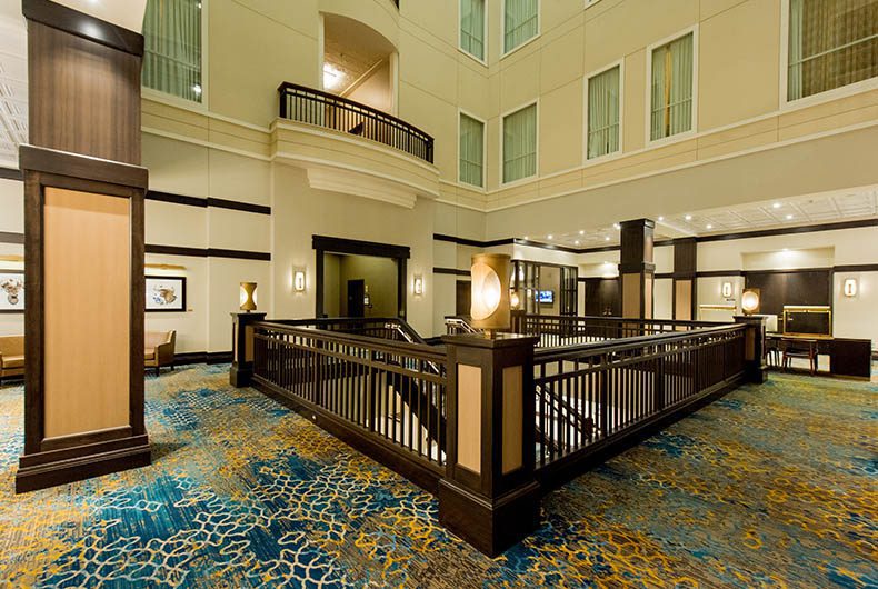 Hotel lobby with custom wood hand railings and stairs