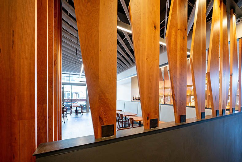 Restaurant banquette seating section and wood paneled partitions