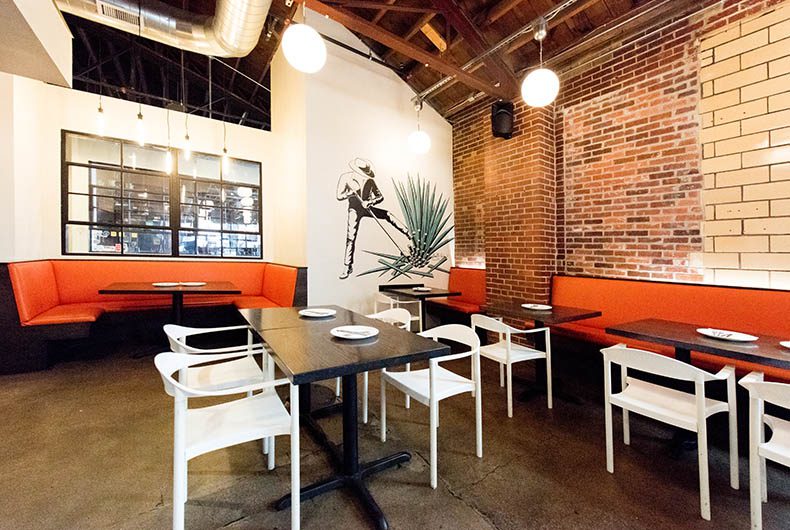 Restaurant dining area with built-in banquettes and table top seating