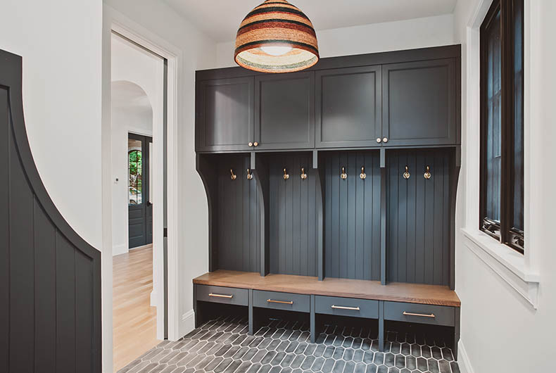 Custom closets and built-in bench for home entrance mud room